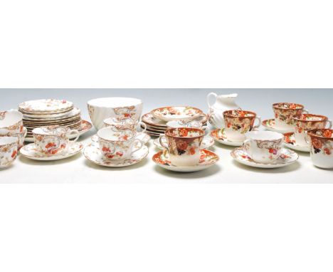 Two vintage English china tea sets to include eight Victorian tea cup trios, creamer jug and creamer each being printed with 