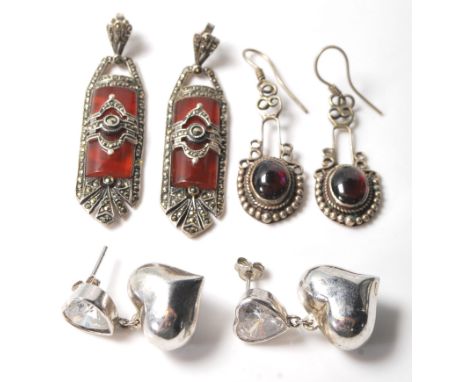A selection of silver antique earrings to include a pair of Art Deco drop earrings having red stone panels set with marcasite