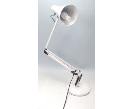A vintage 20th Century Herbert Terry Anglepoise industrial desk lamp finished in white enamel colourway. Raised on circular b