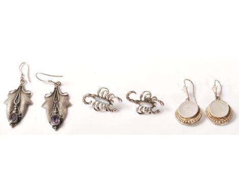 Three pairs of vintage ladies silver earrings to include a pair of Art Nouveau style ivy leaf drop earrings set with oval cut