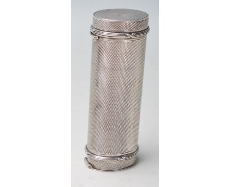 A silver hallmarked engine turned case in a cylindrical form with double ends hinged lids. London silver assay mark “h “ 1923