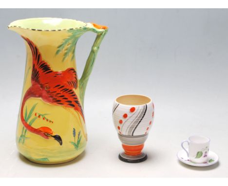 An Art Deco Burleigh Ware large water jug with a raised hand painted flamingo to the side and with a bamboo formed being stam