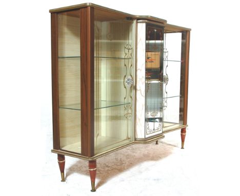 A 1930's Art Deco melamine breakfront china display cabinet / vitrine. Raised on tapering legs supporting a double door glaze