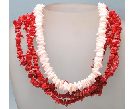 A 20th Century coral necklace having three strands of threaded coral together with a light pink shell fragment necklace. Cora