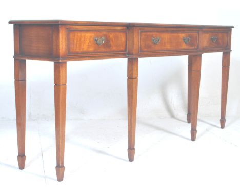 A good Regency revival mahogany breakfront console table.&nbsp; The console being raised on square tapering legs with a serie
