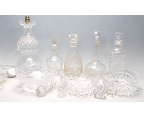 A collection of 20th Century cut glass items to include two large cut glass centrepiece bowls, four cut glass decanters to in