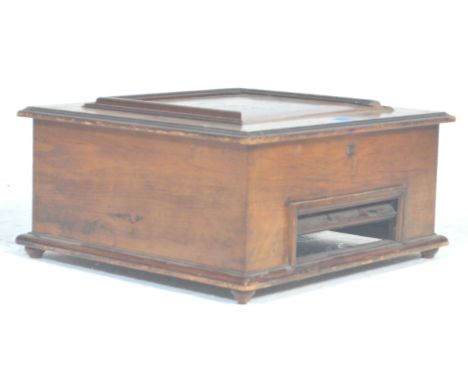 An early 20th Century table top polyphon case of square form having a panelled lid with inlaid marquetry floral design lid, o