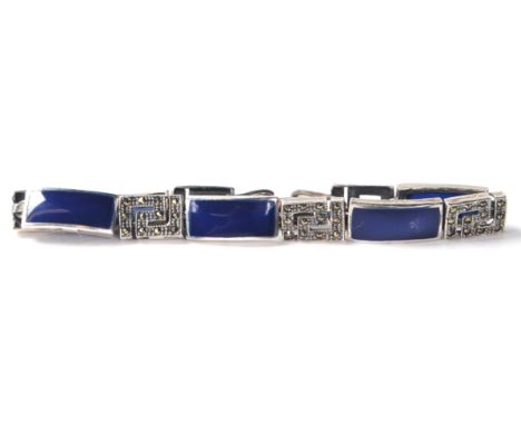 An Art Deco style silver ladies bracelet having marcasite and lapis lazuli decoration. Measure 18cm long. Weighs 15g.&nbsp;
