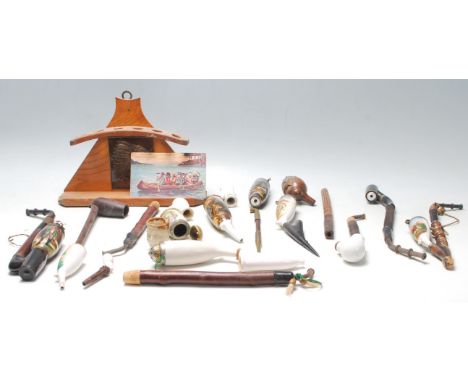 A collection of vintage German porcelain smoking lidded pipes with ceramic bowl and wooden stem, having hunting scenes transf