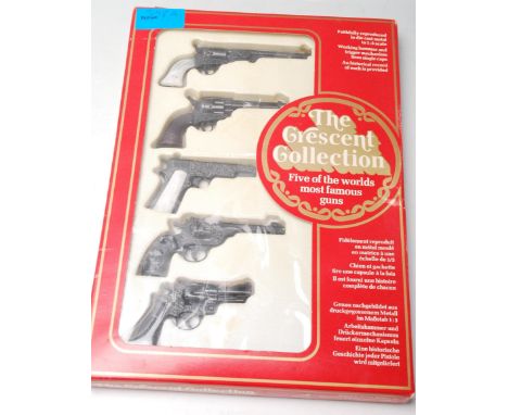 An original retro vintage diecast 1:3 scale Crescent Collection of five of the worlds most famous guns to include, Colt Navy 