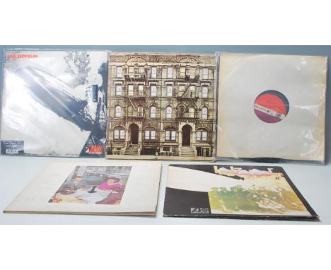 A group of five vinyl long play LP record albums by led Zeppelin to include a brand new and sealed 180g first album reissue. 