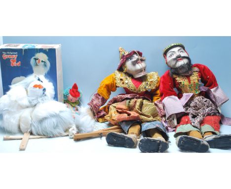 A group of four vintage puppet dolls to include a pair of Thai / oriental dolls having wooden construction with colourful &nb