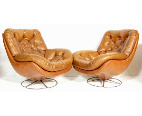A pair of vintage, mid century retro Danish inspired egg chairs&nbsp; - easy swivel armchairs. Each being upholstered with br