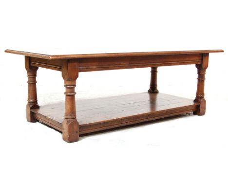 A 20th Century ' Banks of Bristol ' good quality Jacobean revival solid oak coffee table of rectangular form having a chamfer