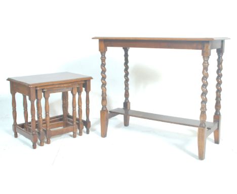 A good mid 20th Century oak nest of tables with turned legs and stretchers supporting graduating table tops. Together with an
