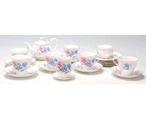 A Royal Albert tea service in the Friendship / Sweet Pea pattern comprising of 6 tea cups, saucers and side plates (trios), a