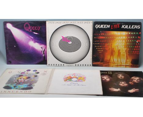A group of six vinyl long play LP vinyl Record albums by Queen to include Queens first album (VG), Queen II (VG) Jazz sadly n