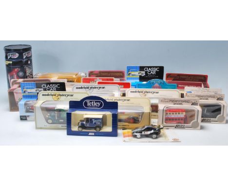 A collection of assorted scale diecast models to include a Corgi, Tyco, Matchbox, Lledo,&nbsp; All models appear mint in thei