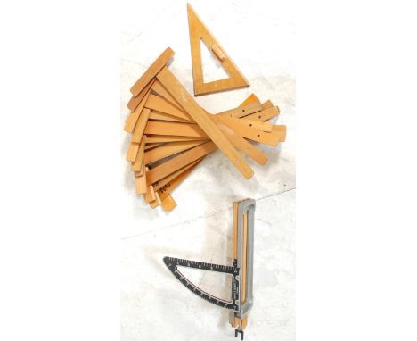 A selection of vintage 20th century Industrial wooden Architects - engineers set squares together with a Griffin &amp; George