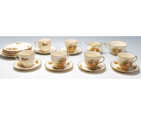 An early 20th century Alfred Meakin English tea service to include six cups, six saucers plates, a jug and a bowl. All being 