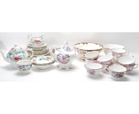 A collection of fine bone china dinner services comprising of Booths Floradora period tea cups, saucers, bowls, tea pots, mil