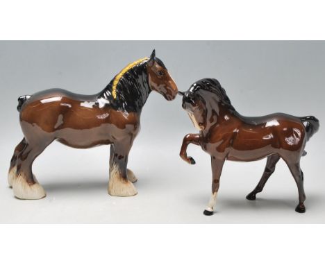 Two 20th Century Beswick ceramic horse figurines to include a brown shire horse with a braided main and a brown stallion with