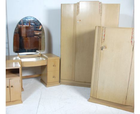 An Art Deco 1930's&nbsp; retro vintage limed oak bedroom suite in the manner of Heals. The suite comprising of a double wardr