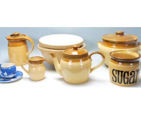 A collection of retro vintage mid century kitchenalia to include a ceramic kettle, jug, sugarpot, and cookie jar by T G Green