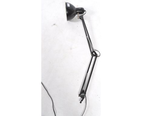 A mid century Scandinavian style Industrial anglepoise desk lamp. The black colourway lamp with adjustable arm set to a brack
