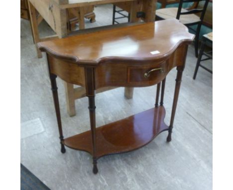 A late Victorian satinwood inlaid rosewood demi-lune card table, the fold-over serpentine front top over a frieze drawer, rai