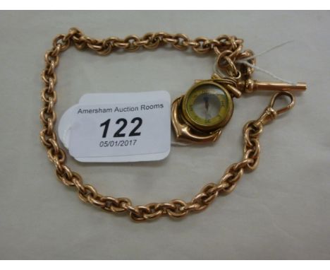 A gold coloured metal oval ring link watch chain, Albert and dog clip with a 9ct gold anchor design compass pendant       11