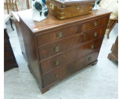 An early/mid 19thC mahogany dressing chest with two short/three long graduated drawers, raised on bracket feet  36''h  42''w 