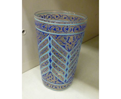 A late 19th/early 20thC glass beaker, painted in dark and light blue enamel with Islamic designs        OS4