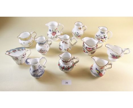 A set of twelve Compton and Woodhouse reproduction Worcester jugs