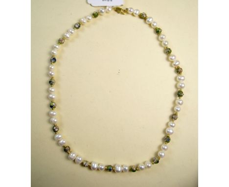 A freshwater pearl necklace with green enamel and filigree beads