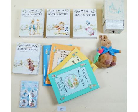 A Peter Rabbit soft toy FW &amp; Co 2008, a miniature book case containing twelve Beatrix Potter books, four boxes of four Be