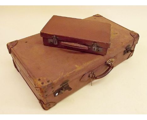 A Smiths Trunk Stores leather suitcase and another small case