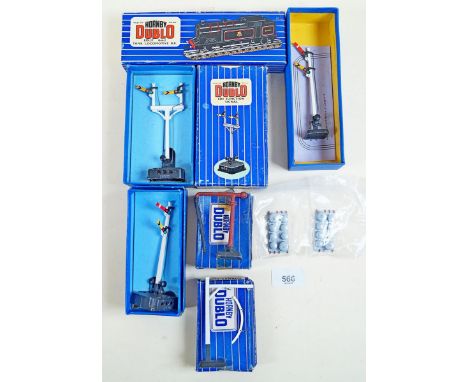 A group of Hornby Dublo items including: three rail trackside components - boxed, DI loading gauge , DI water crane, ED3 junc