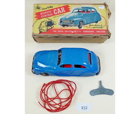 A vintage Chad Valley remote control tin plate clockwork car with key - boxed