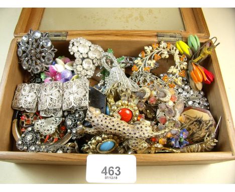 A box of vintage brooches and costume jewellery