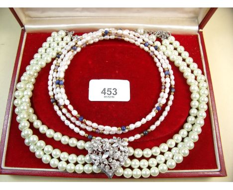A three strand pearl choker with diamonte heart shaped central panel and three freshwater and sprung chokers - two with lapis