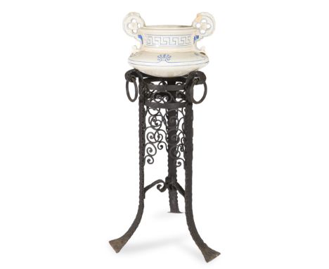 Planter from the end of the 19th century.Ceramic flowerpot stand and wrought iron foot.Measurements: 113 cm of height of the 