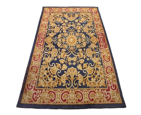 Carpet; Royal Tapestry Factory, Madrid, c.1950.Wool.Some wear and tears on the border.Signed.Measurements: 400 x 285 cm.The R