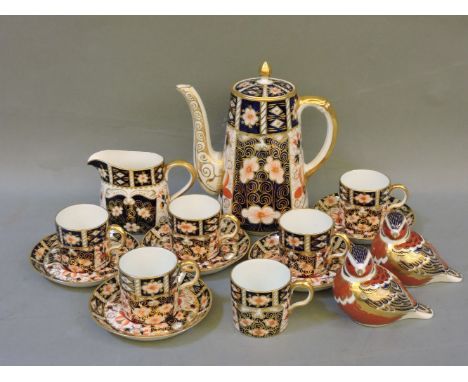 A Royal Crown Derby Imari pattern coffee pot, 2451, damaged, with six coffee cans, five coffee saucers, a milk jug, and two R