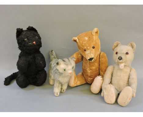 A collection of vintage teddy bears, including a mohair example with open mouth, possibly Steiff