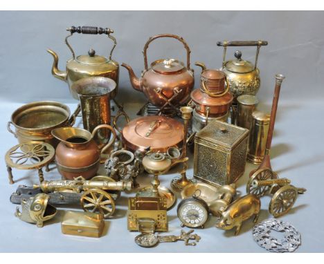 Two boxes of old copper and brassware, including a brass miner's lamp, and three kettles on stands