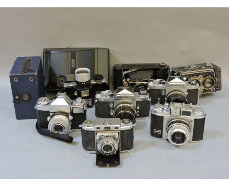 A collection of vintage cameras, including Rolleiflex, a Compur bellows example, a Miranda, together with a collection of ran