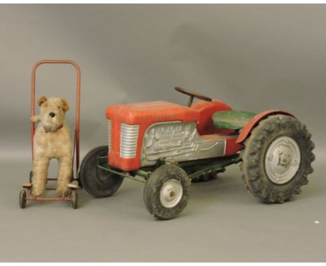 A Triang plastic child's tractor, 89cm long, and a push along dog