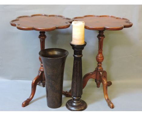 Two reproduction mahogany tripod tables, a turned wooden vase, and candlestick