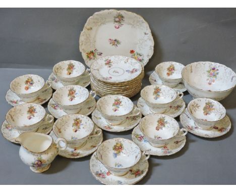 A Coalport part tea service, with gilt and floral decoration, to include ten cups, eleven saucers, and eleven tea plates